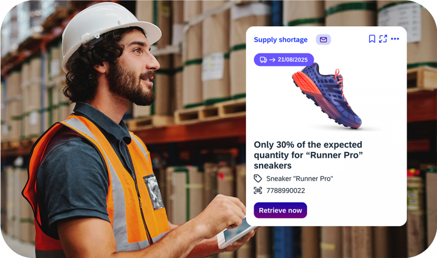 Warehouse worker with helmet uses tablet to inform about supply shortage of Runner Pro sneakers in iNFOHUB