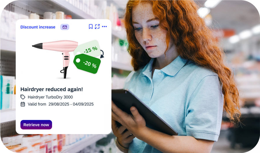 Employee with tablet sees current discount information on hair dryers in the shelf area in iINFOHUB
