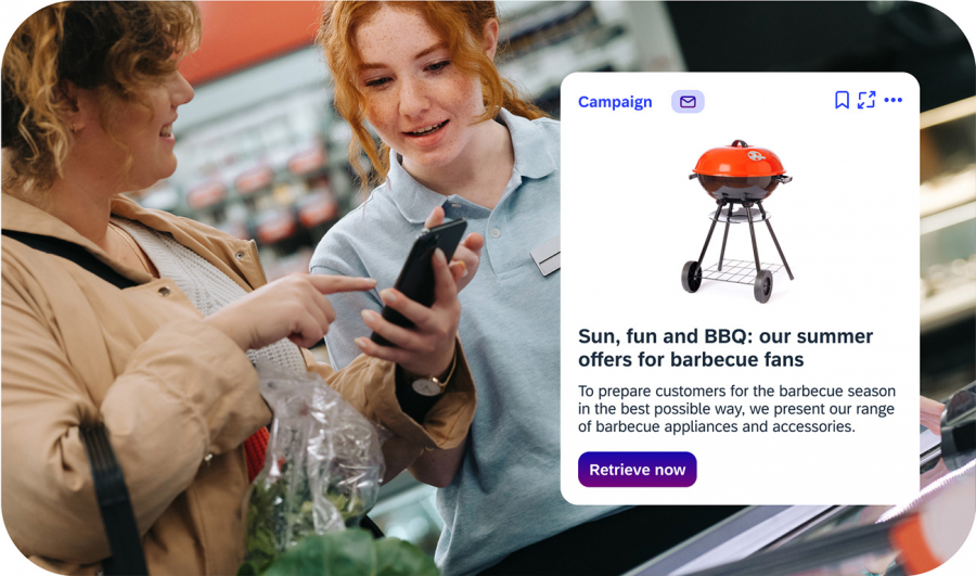Two retail employees discuss the current barbecue campaign and offers directly on their smartphones via iNFOHUB