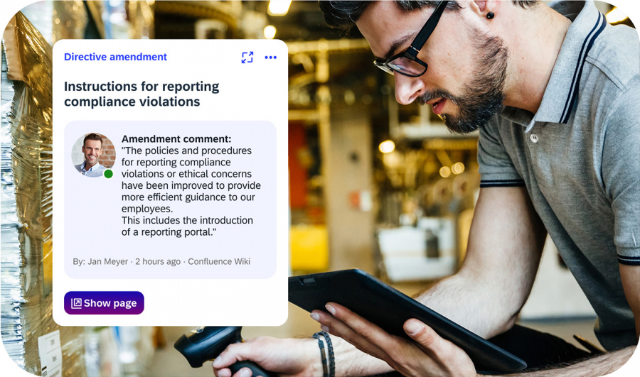 Industrial worker with tablet reading iNFOHUB policy update on reporting compliance violations